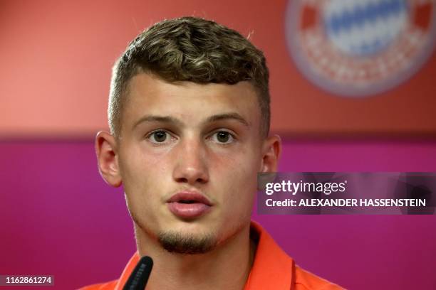 French midfielder Mickael Cuisance, new recruit of German first division Bundesliga football club Bayern Munich, attends a press conference during...