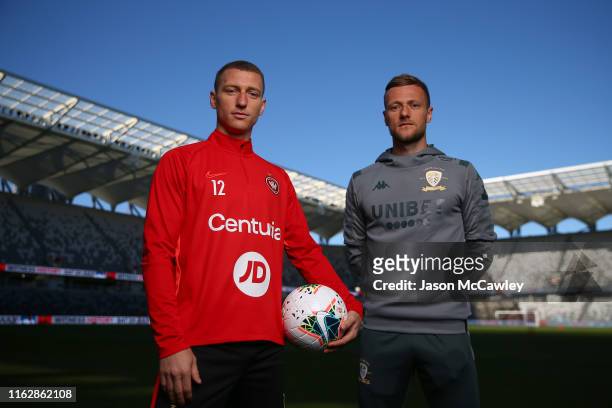 Mitchell Duke of the Wanderers and Liam Cooper of Leeds United pose during a Leeds United media opportunity at Bankwest Stadium on July 19, 2019 in...