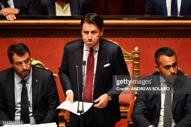 Italian Prime Minister Giuseppe Conte , flanked by Deputy Prime Minister and Interior Minister Matteo Salvini and by Deputy Prime Minister and...