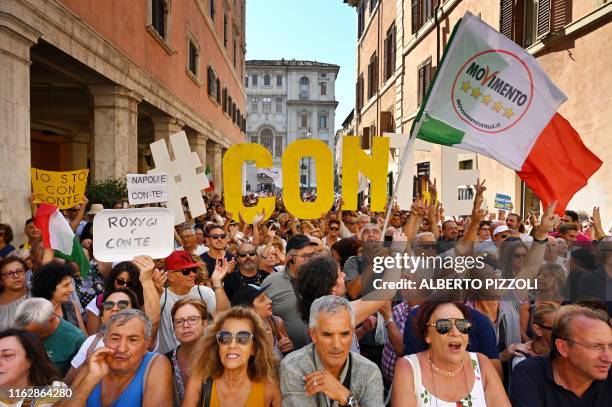 The anti-establishment Five Star Movement supporters demonstrate in front of the Senate as Italy's Prime Minister, Giuseppe Conte arrives on August...