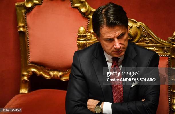 Italian Prime Minister Giuseppe Conte reacts after delivering a speech at the Italian Senate, in Rome, on August 20 as the country faces a political...