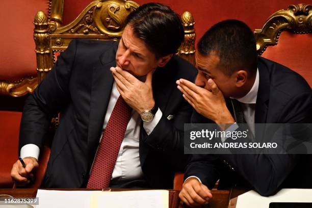 Italian Prime Minister Giuseppe Conte speaks with Deputy Prime Minister and Minister of Economic Development, Labour and Social Policies, Luigi Di...