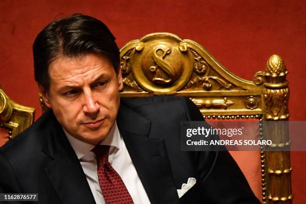 Italian Prime Minister Giuseppe Conte reacts after delivering a speech at the Italian Senate, in Rome, on August 20 as the country faces a political...