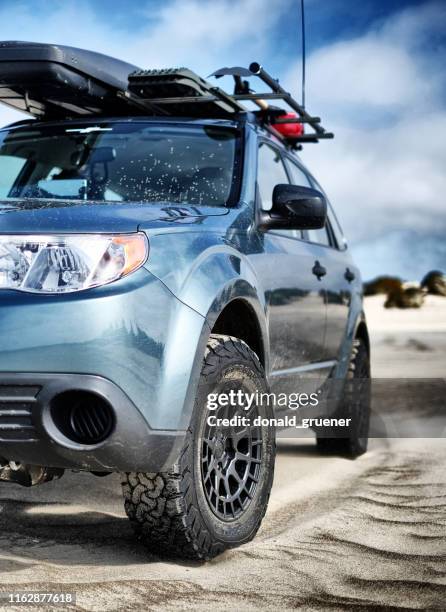 subaru forester on the oregon dunes - forester stock pictures, royalty-free photos & images
