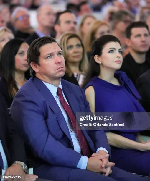 Florida Gov. Ron DeSantis and first lady Casey DeSantis listen during the Project Opioid conference on Tuesday, Aug. 20, 2019 at First Presbyterian...
