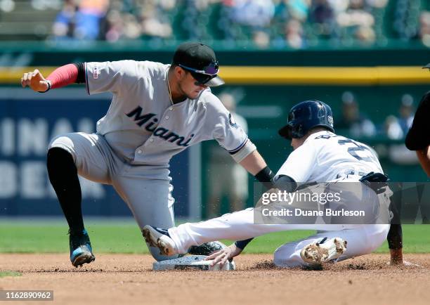 Shortstop Miguel Rojas of the Miami Marlins keeps the tagt on Gordon Beckham of the Detroit Tigers during the first inning at Comerica Park on May...