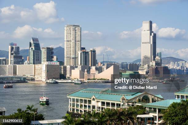 star ferry crossing the victoria harbor in hong kong - tsim sha tsui stock-fotos und bilder