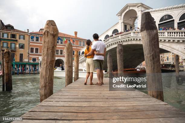 lovely asian couple in venice - italy for their honeymoon - venice with couple stock pictures, royalty-free photos & images
