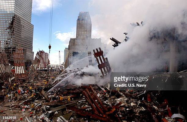 Fires still burn amidst the rubble of the World Trade Center September 13, 2001 days after the September 11, 2001 terrorist attack.
