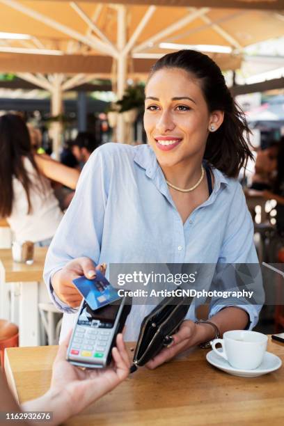 woman making card payment. - card payment stock pictures, royalty-free photos & images