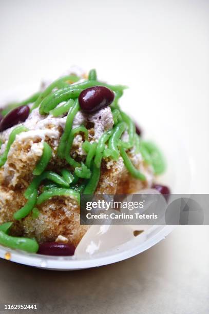 bowl of ice cendol - coconut shaving stock pictures, royalty-free photos & images
