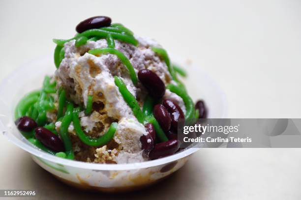 bowl of ice cendol - coconut shaving stock pictures, royalty-free photos & images