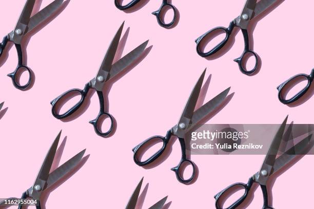 repeated vintage scissors on pink background - scissors stock pictures, royalty-free photos & images