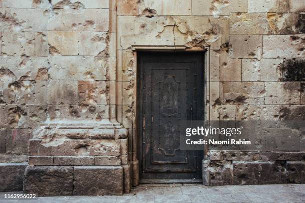 plaça de sant felipe neri in barcelona's gothic quarter with shrapnel damage from the spanish civil war - bullet hole in wood stock pictures, royalty-free photos & images