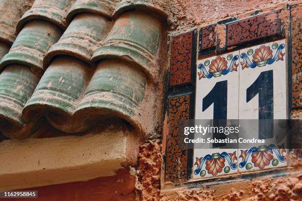 traditional number of the moroccan house, in the medina district, white medina of essaouira, morocco. - eleventh stock pictures, royalty-free photos & images