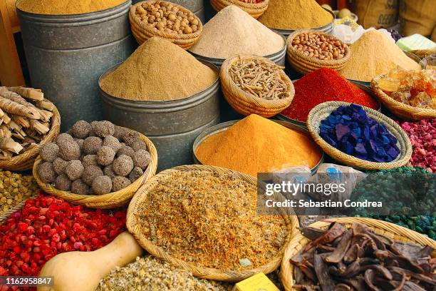 moroccan exotic herbs and spices on market stall, retail morocco, africa travel. - exotic food market photos et images de collection