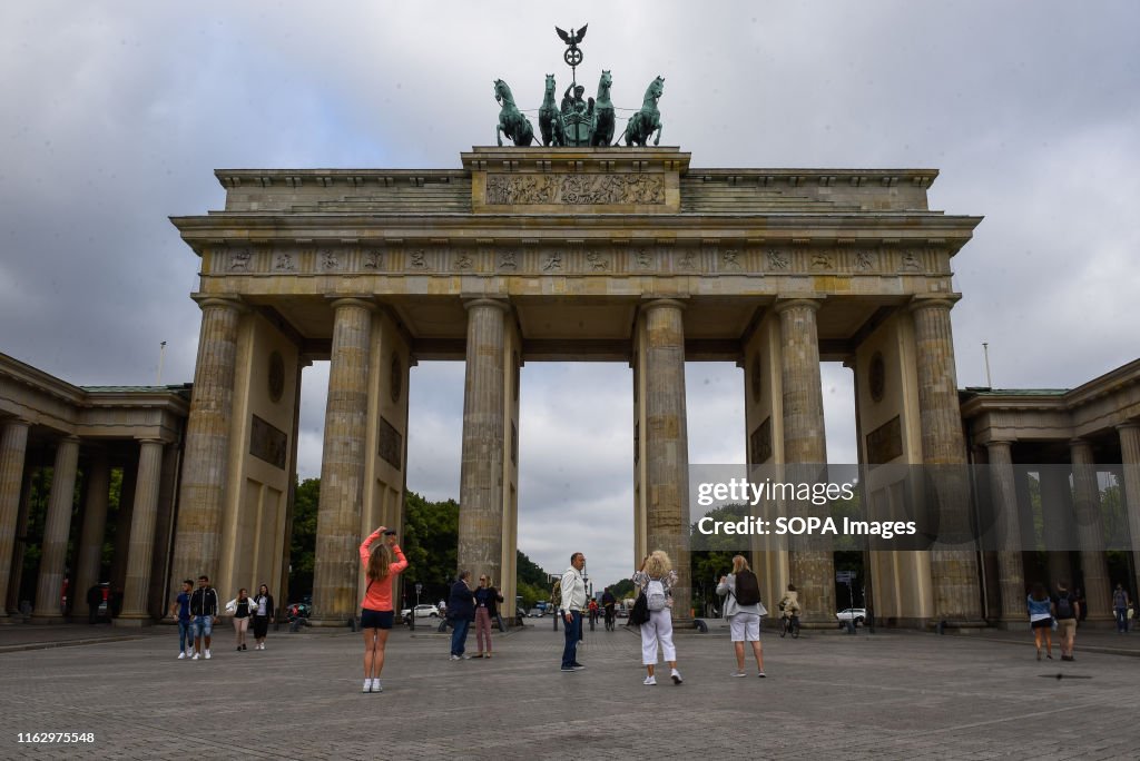 Tourists at the Brandenburg Gate in Berlin...