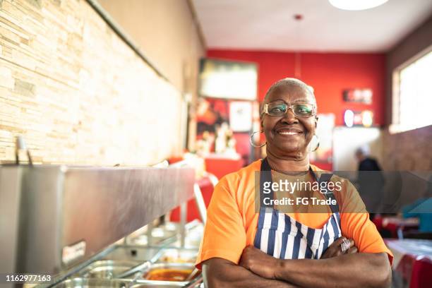 portrait of senior waitress looking at camera - personal chef stock pictures, royalty-free photos & images