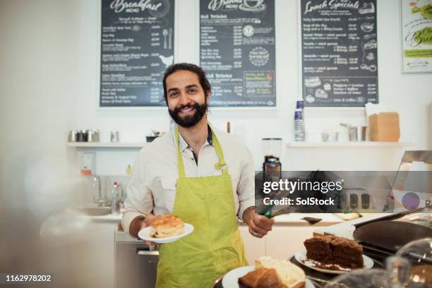 happy barista at work - cafe culture uk stock pictures, royalty-free photos & images