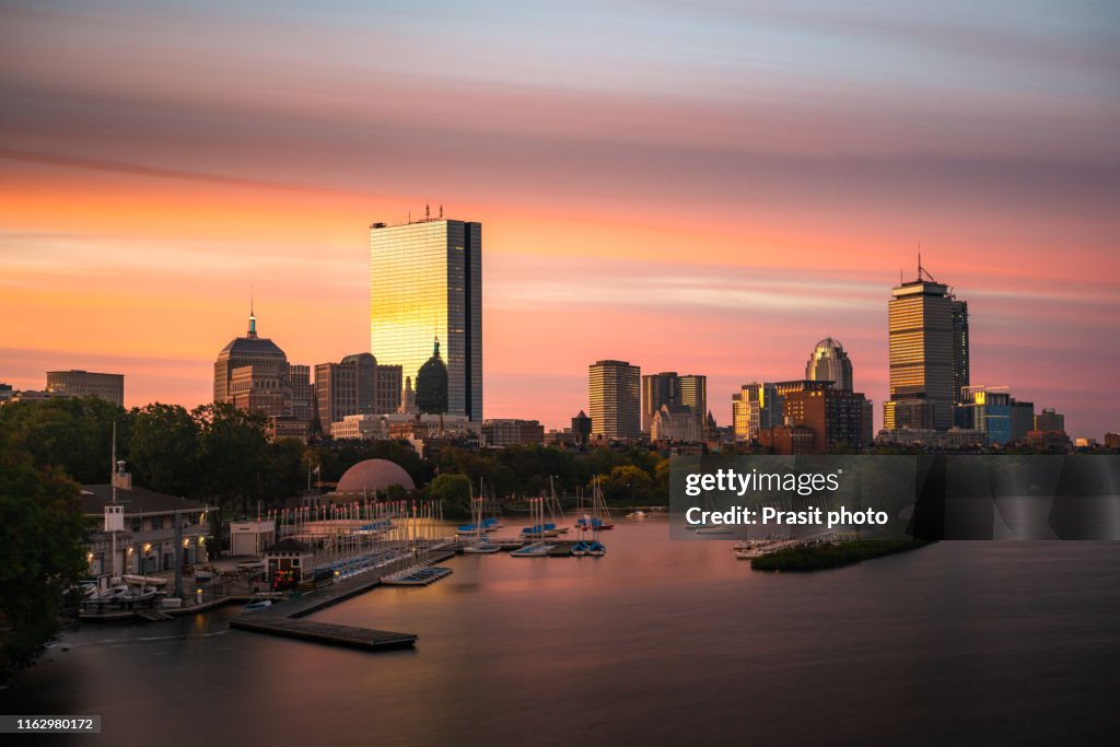 Aerial view of Black Bay Financial District with skyscrapers and yacht dock in Charles river at night in Boston, Massachusetts, USA. Travel destination in USA concept.