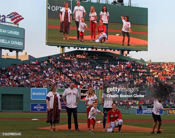 Nick Cafardos grandchildren Annabella and Noah Cafardo throw out the ceremonial first pitch honoring the memory of former Boston Globe reporter Nick...