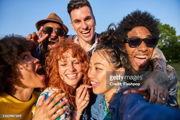 group of friends having fun - multiracial group stock-fotos und bilder
