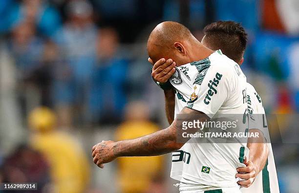 Felipe Melo of Brazil's Palmeiras reacts after being expelled during a Copa Libertadores football match against Brazil's Gremio at the Arena do...