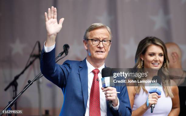 Anchors Steve Doocy and Jillian Mele are on stage as Phil Vassar performs on "FOX & Friends" All-American Summer Concert Series on July 19, 2019 in...