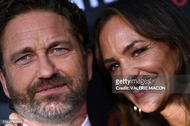 Scottish actor Gerard Butler and girlfriend US actress Morgan Brown arrive for the Los Angeles premiere of "Angel Has Fallen" at the Regency Village...