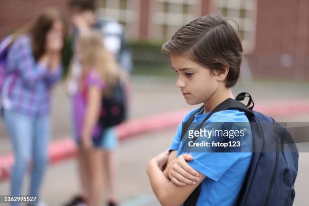 elementary age pojke som mobbas i skolan. - hot latino girl bildbanksfoton och bilder