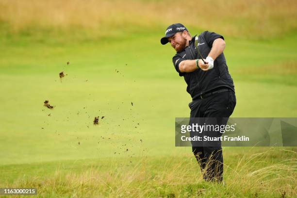 Shane Lowry of Ireland plays a shot on the 14th hole during the second round of the 148th Open Championship held on the Dunluce Links at Royal...