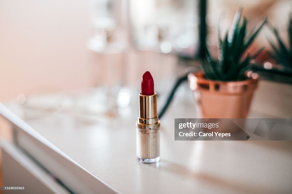 Red lipstick on dressing table
