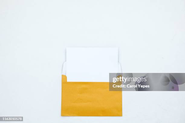 opened white envelope with blank card on white background - greeting card and envelope stock pictures, royalty-free photos & images