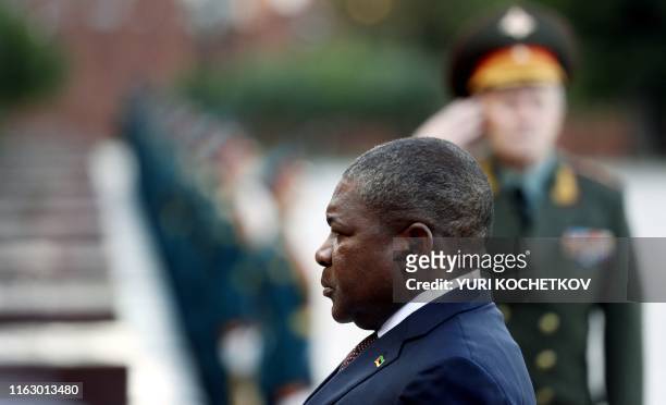 Mozambique President Filipe Nyusi attends a wreath laying ceremony at the Tomb of the Unknown Soldier in central Moscow, on August 21 as part of his...