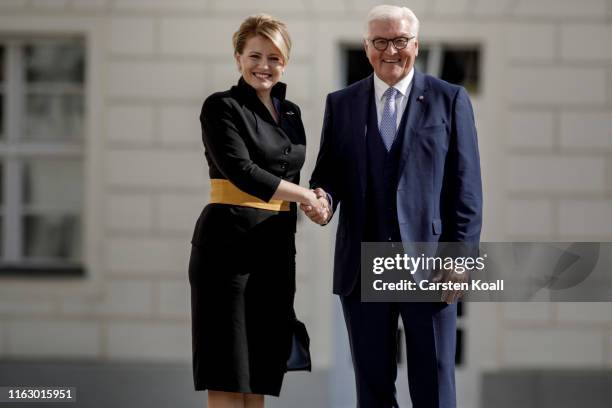 German President Frank-Walter Steinmeier greets new Slovak President Zuzana Caputova upon Caputova's arrival at Schloss Bellevue on August 21, 2019...