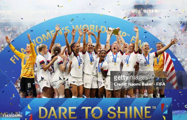 Players from USA lift the FIFA Women's World Cup Trophy following her team's victory the 2019 FIFA Women's World Cup France Final match between The...