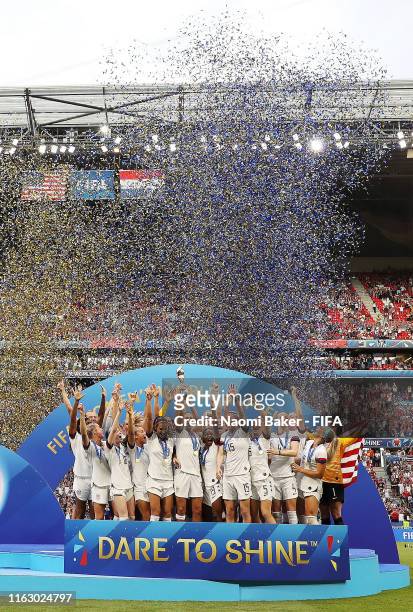 Players from USA lift the FIFA Women's World Cup Trophy following her team's victory the 2019 FIFA Women's World Cup France Final match between The...