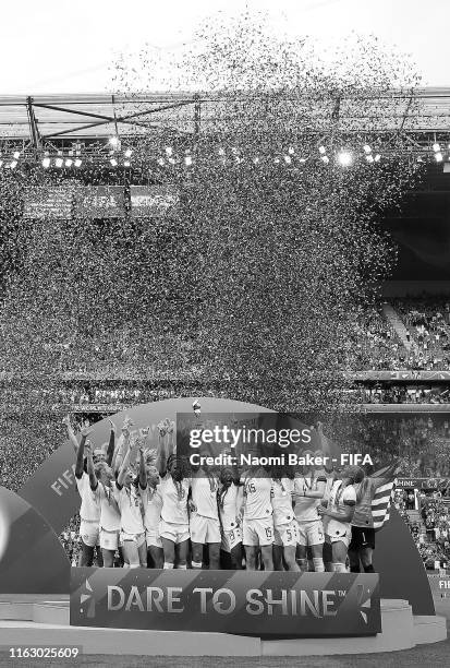 Players from USA lift the FIFA Women's World Cup Trophy following her team's victory the 2019 FIFA Women's World Cup France Final match between The...