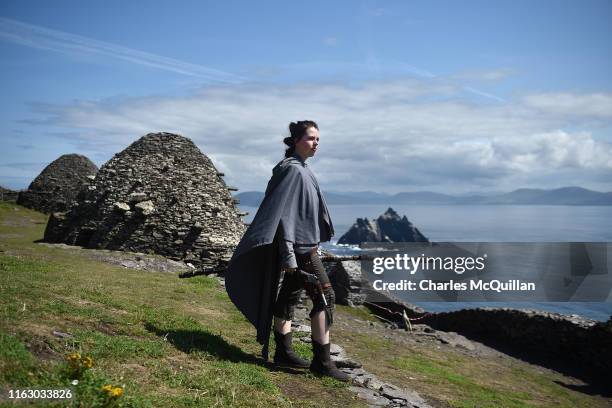 Star Wars fan and cosplayer Sharon Zonneveld, dressed as the character Rey poses for a photograph as she attempts to replicate poses and scenes from...