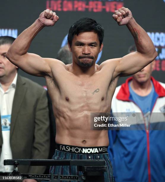 Welterweight champion Manny Pacquiao poses on the scale during his official weigh-in at MGM Grand Garden Arena on July 19, 2019 in Las Vegas, Nevada....