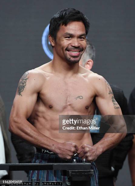Welterweight champion Manny Pacquiao poses on the scale during his official weigh-in at MGM Grand Garden Arena on July 19, 2019 in Las Vegas, Nevada....