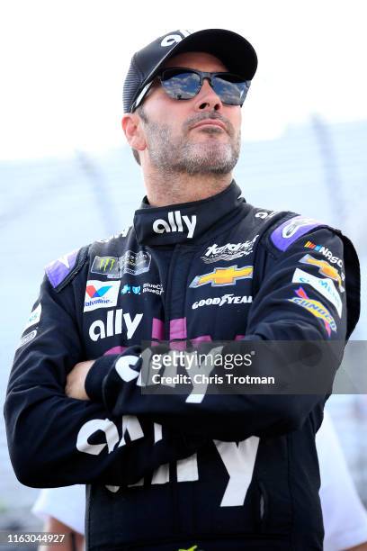 Jimmie Johnson, driver of the Ally Chevrolet, stands by his car during qualifying for the Monster Energy NASCAR Cup Series Foxwoods Resort Casino 301...