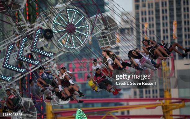 Riders on the Wave Swinger at The Canadian National Exhibition, know as simply "The Ex", runs over the last two weeks of the summer since 1879 at the...