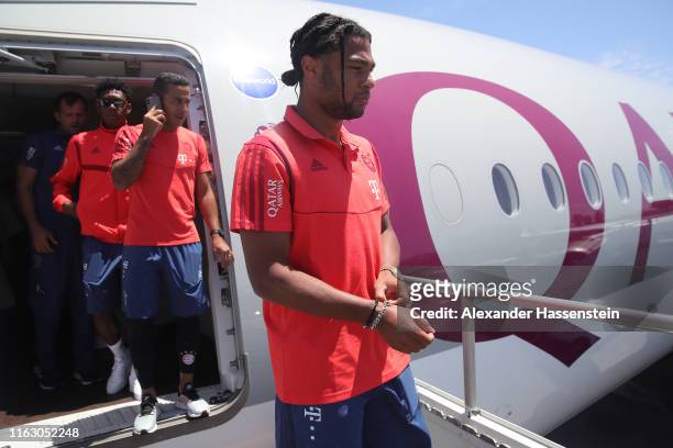 David Alaba, Thiago Alcantara and Serge Gnabry of FC Bayern Muenchen look on at the Los Angeles International Airport to depart with the team flight...
