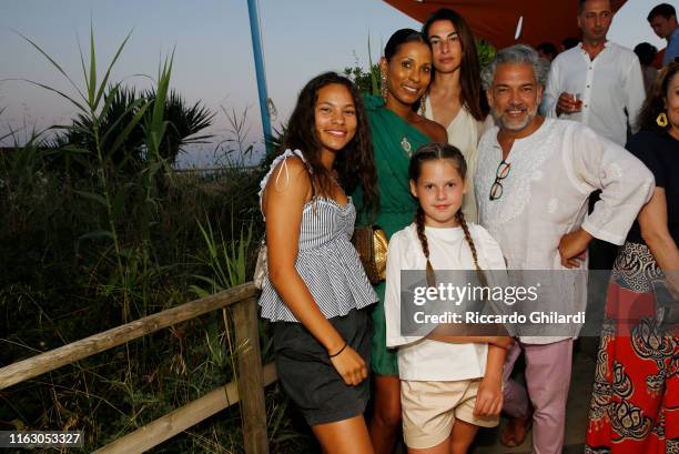 Guest, Sherrett Dahlstrom, Annalisa Bugliani with her daughter and Carlos Mota attend the welcome dinner celebrating the opening of Rachel Lee...