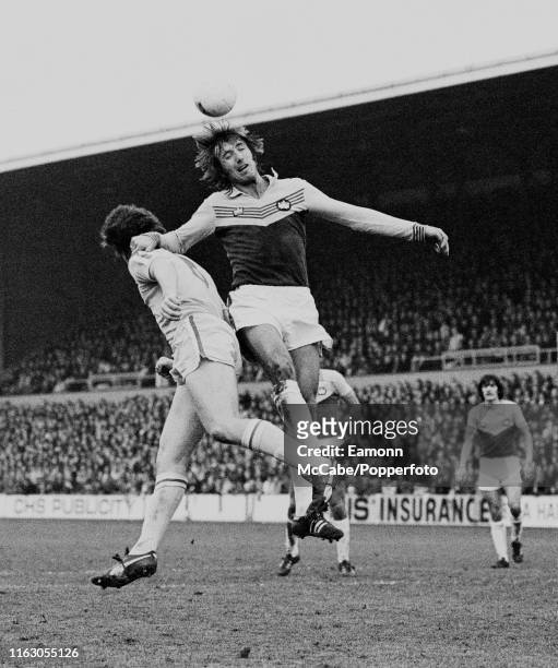 Billy Bonds of West Ham United out jumps a Leeds United player during a Football League Division One match at Upton Park on November 26, 1977 in...