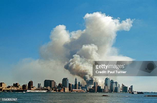 As seen from New Jersey, smoke hangs over South Manhattan after the collapse of the twin towers of the World Trade Center in a terrorist attack, New...