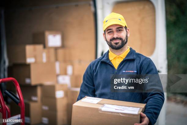 Delivery Man Pose Photos and Premium High Res Pictures - Getty Images