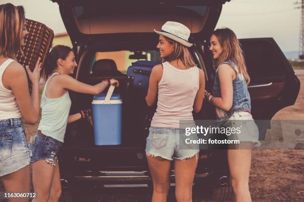 girlfriends preparing for a road trip - car camping luggage stock pictures, royalty-free photos & images