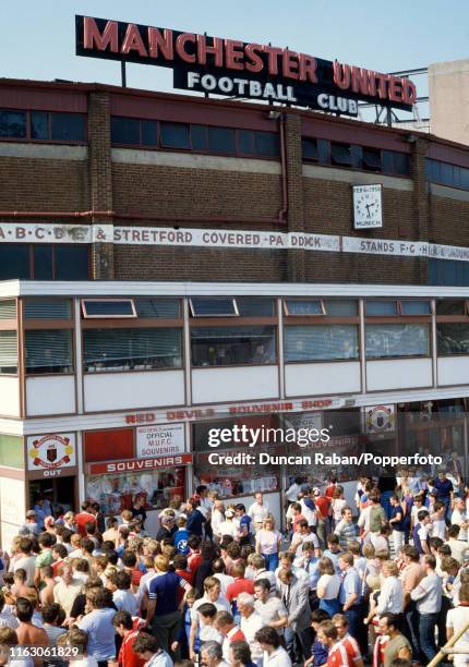Fans gather outside the souvenir shop before the Canon League Division One match between Manchester United and Watford at Old Trafford on August 25,...
